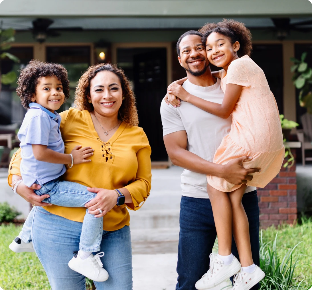 Smiling parents with two young children